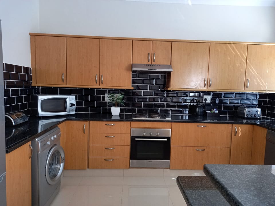 Standard Apartment, 3 Bedrooms | Private kitchen | Full-size fridge, microwave, stovetop, coffee/tea maker
