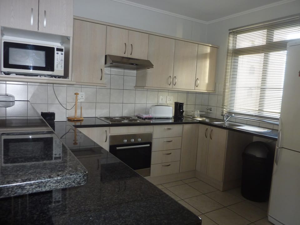 Standard Apartment, 2 Bedrooms | Private kitchen | Full-size fridge, microwave, stovetop, coffee/tea maker