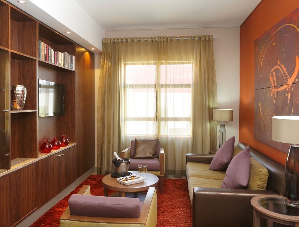 Executive Suite | In-room safe, desk, laptop workspace, iron/ironing board