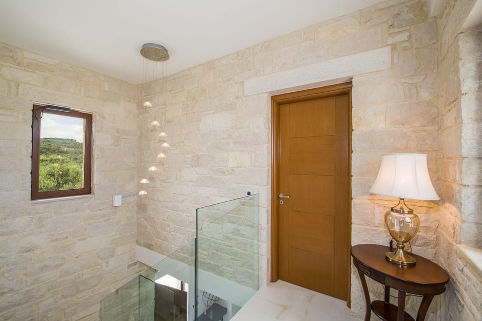 Villa | Living area | Flat-screen TV, fireplace