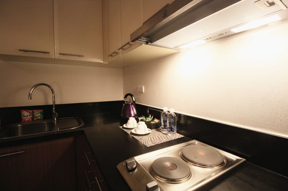 Basic Studio | Private kitchenette | Full-size fridge, microwave, stovetop, cookware/dishes/utensils