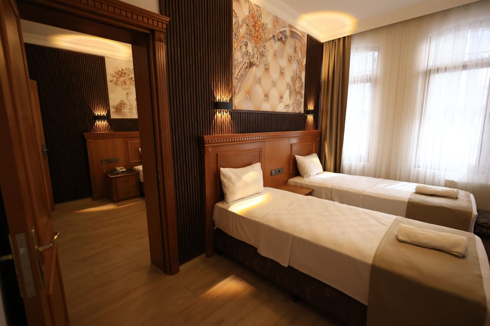 Family Quadruple Room | Minibar, desk, blackout drapes, soundproofing
