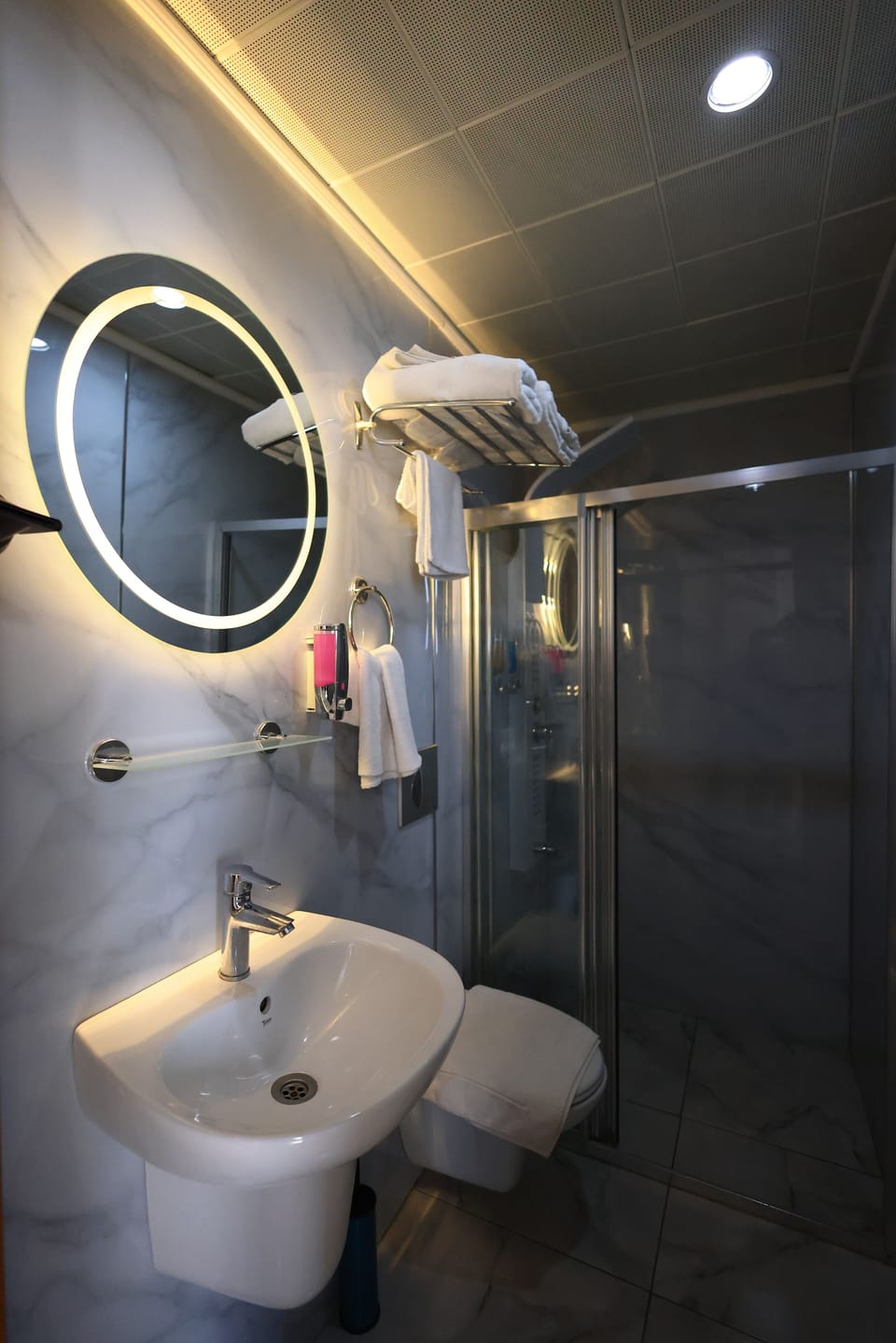 Shower, hair dryer, slippers, towels