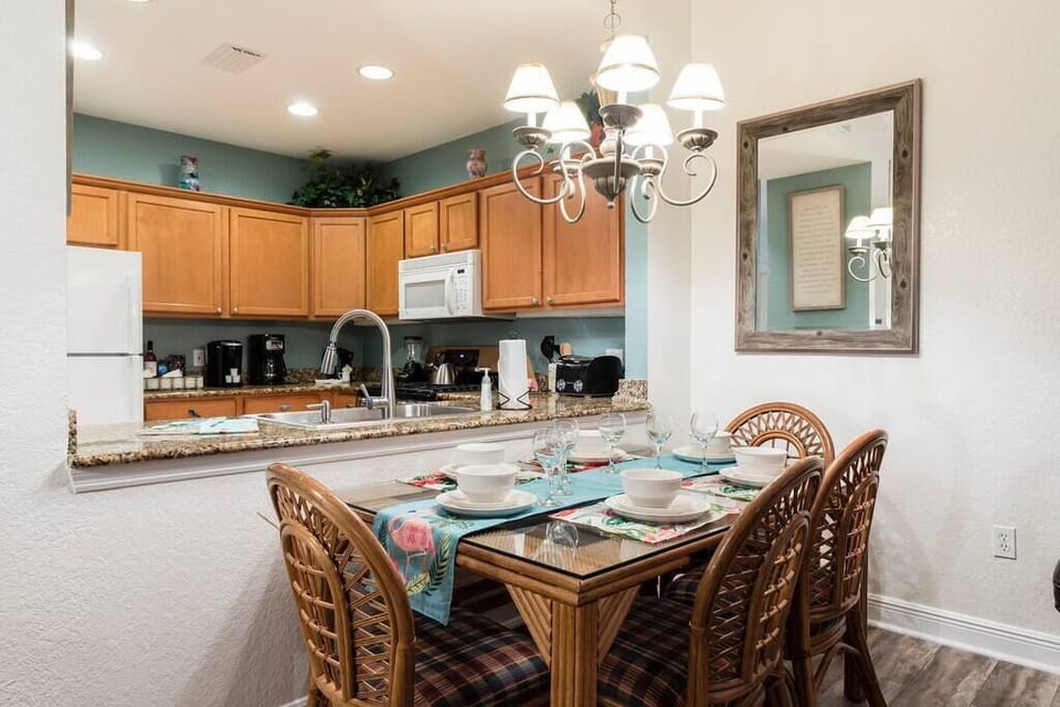 Dining table for 6. Outside patio on the 2nd floor includes a table & chairs for 4.