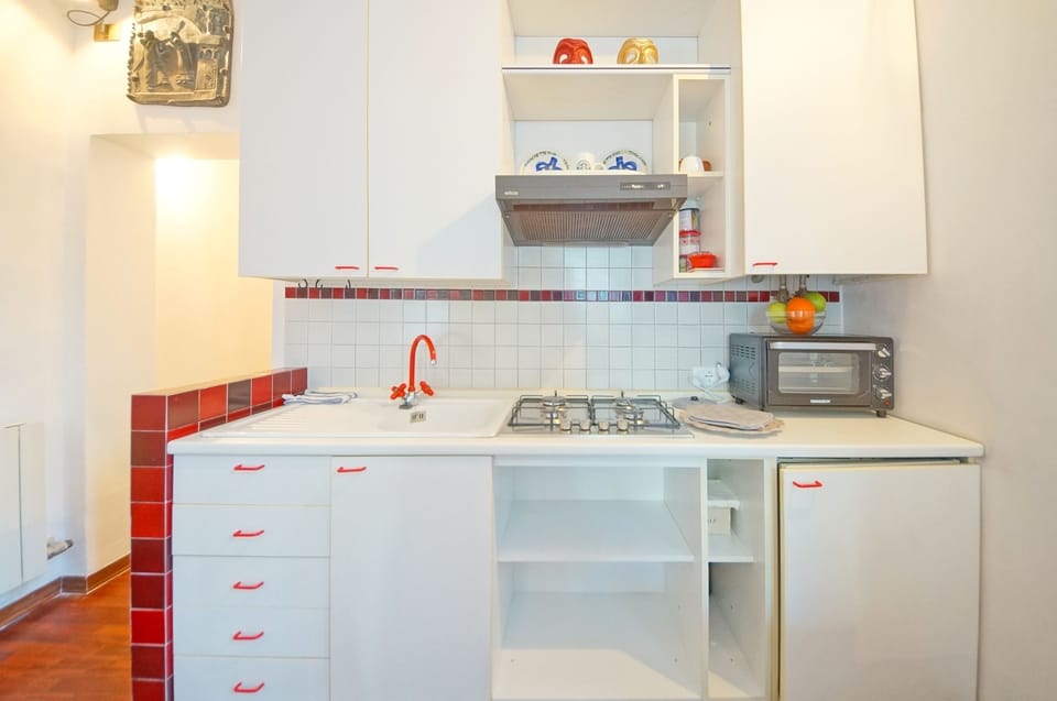 Apartment, 1 Bedroom | Private kitchenette | Full-size fridge, stovetop, electric kettle, toaster