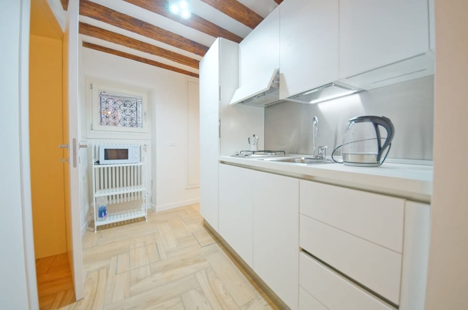 Apartment, 1 Bedroom | Private kitchen | Full-size fridge, microwave, stovetop, coffee/tea maker