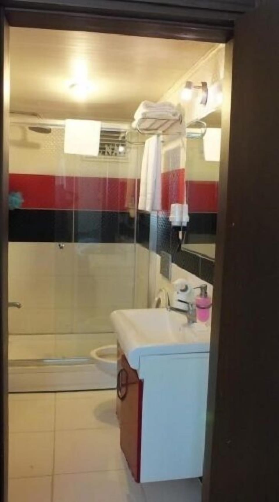 Shower, hydromassage showerhead, hair dryer, towels