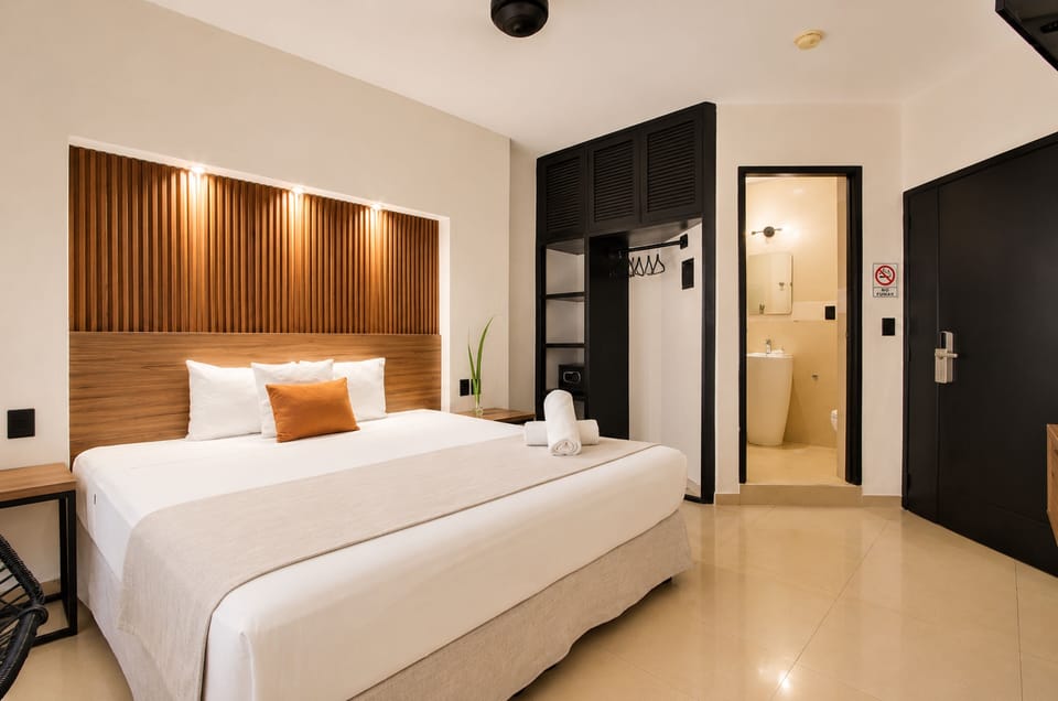 Deluxe Room, 1 King Bed | Down comforters, pillowtop beds, in-room safe, desk