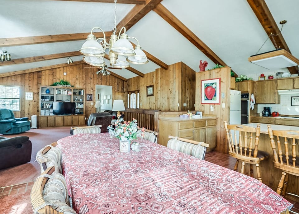 Gather, dine, and unwind in a warm wood-lined cabin made for memories. 