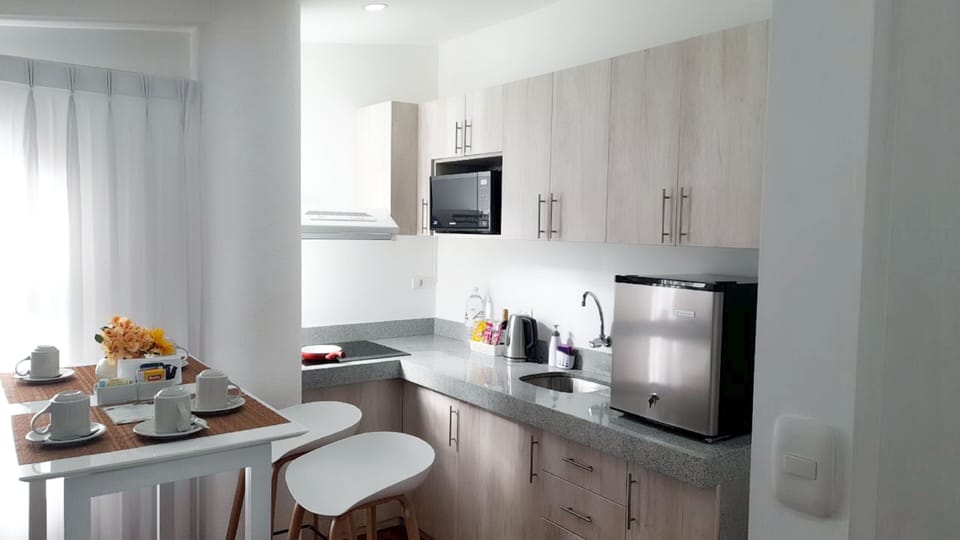 Junior Apartment | Private kitchen | Full-size fridge, microwave, coffee/tea maker, electric kettle