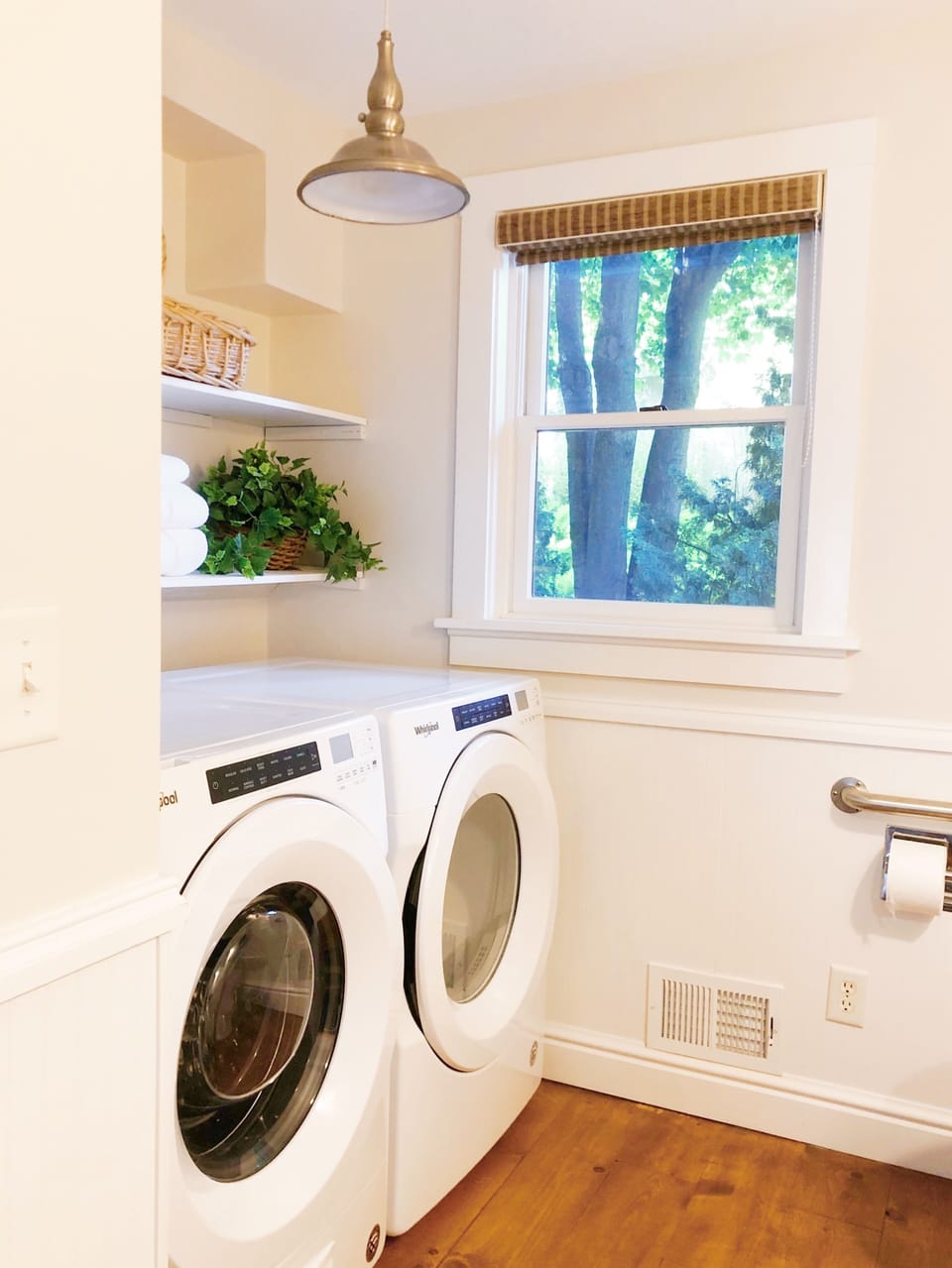Main Floor Bathroom with shower and Front Load High Efficiency Washer & Dryer