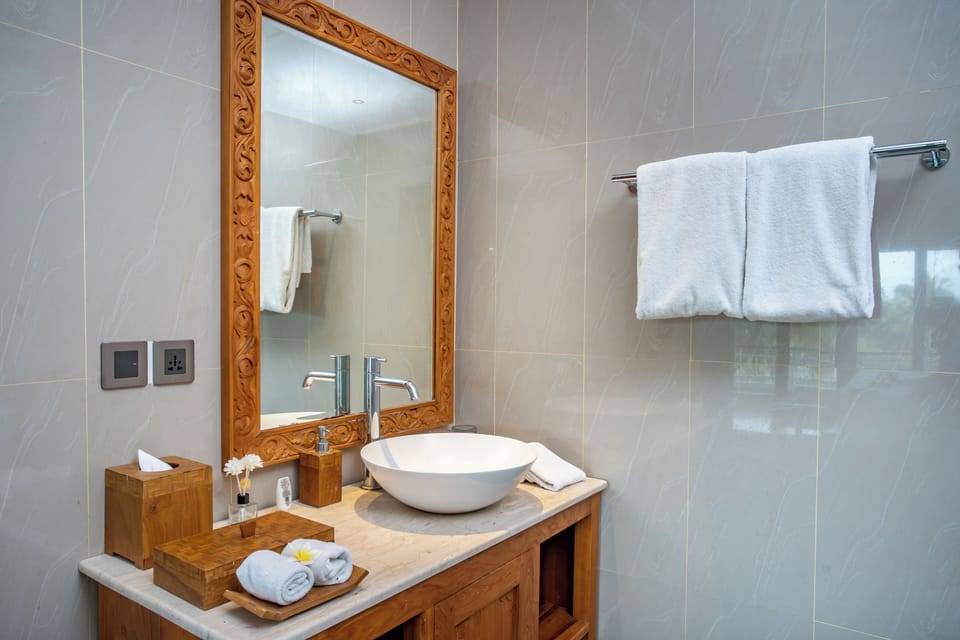 Suite Balcony with Rice Field View | Bathroom | Shower, slippers, soap, shampoo