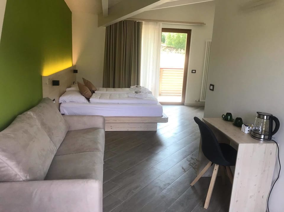 Deluxe Quadruple Room, Balcony | Blackout drapes, soundproofing, free WiFi, bed sheets