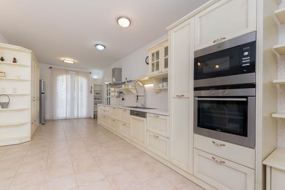 Villa | Private kitchen | Fridge, microwave, oven, stovetop