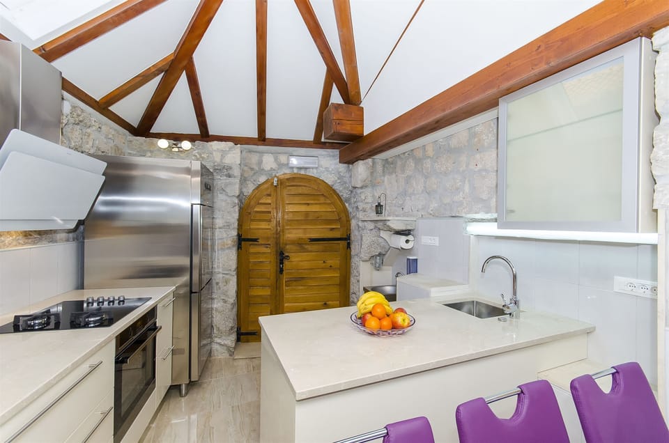 Villa | Private kitchen | Fridge, microwave, oven, stovetop