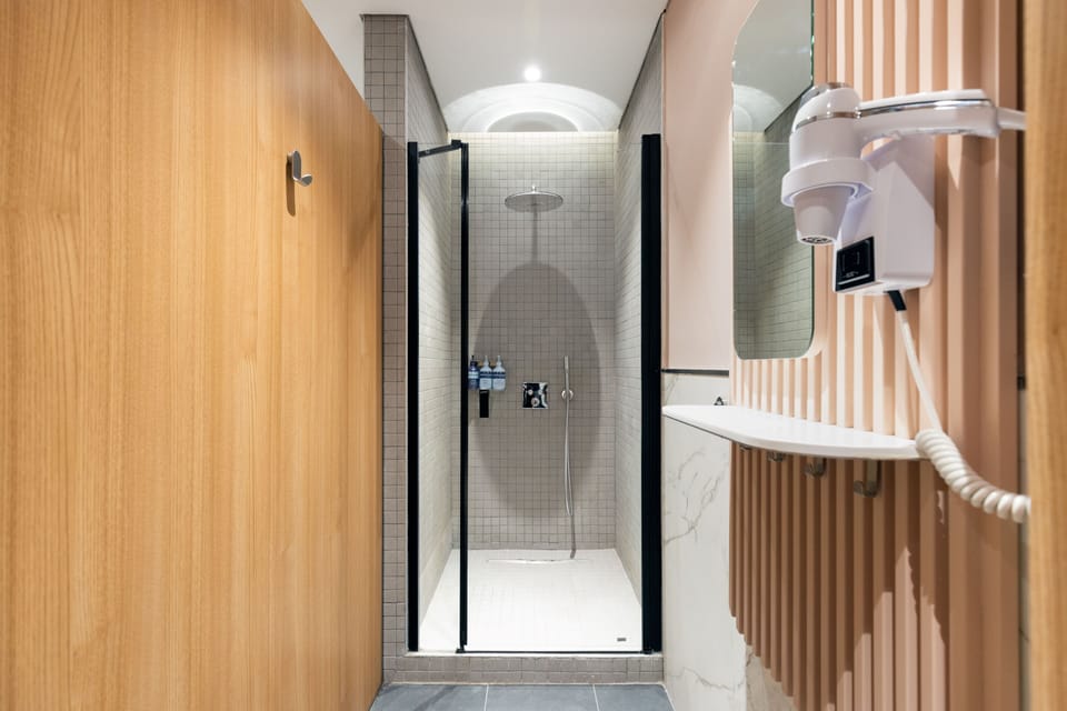 Recharge Cabin | Bathroom | Hair dryer, slippers, towels, soap