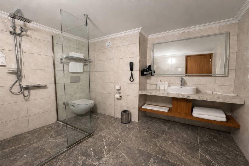 Shower, free toiletries, hair dryer, slippers