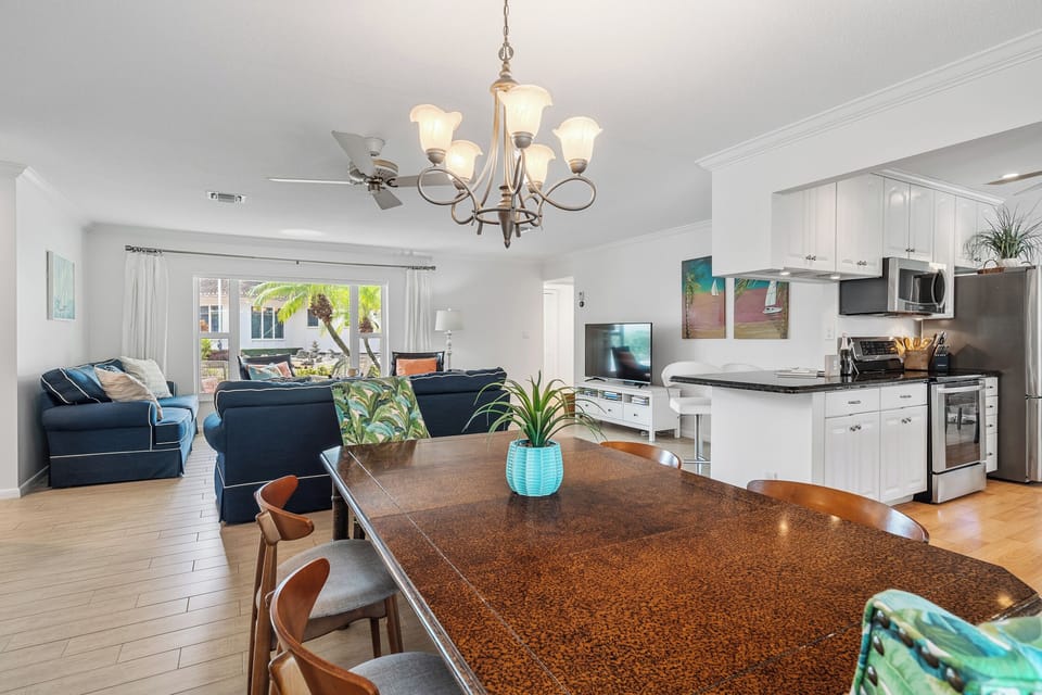 Dining room table seats six and can accommodate 12 with additional two leaves 