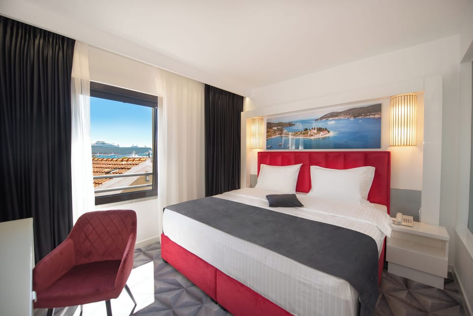 Standard Double Room, Partial Sea View | Premium bedding, in-room safe, desk, blackout drapes