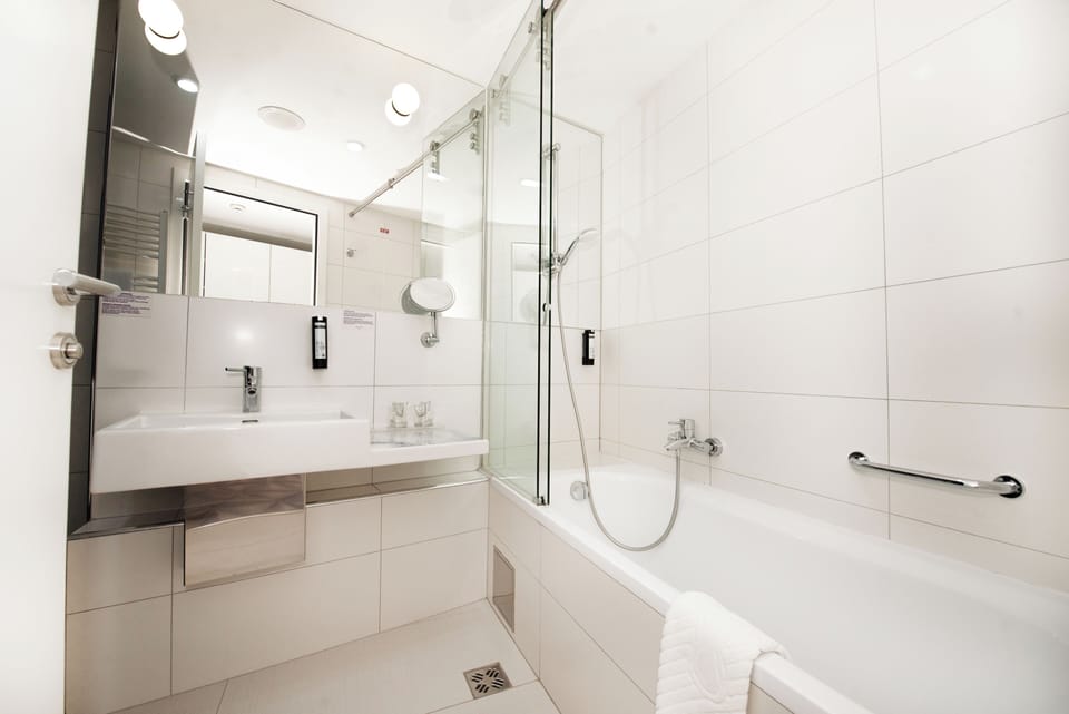 Suite | Bathroom | Designer toiletries, hair dryer, bathrobes, slippers