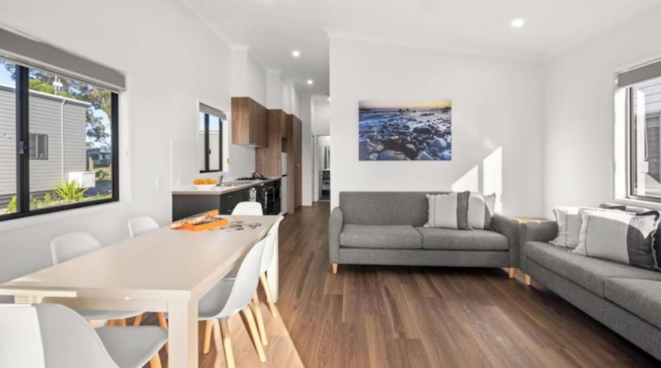 Deluxe 2 Bedroom Cabin - Sleeps 6 | Living area | 25-inch flat-screen TV with cable channels, TV