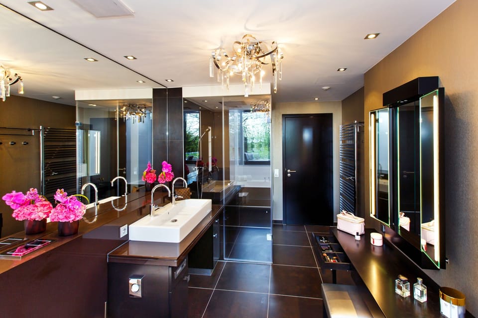 Grand Suite | Bathroom | Designer toiletries, hair dryer, bathrobes, slippers