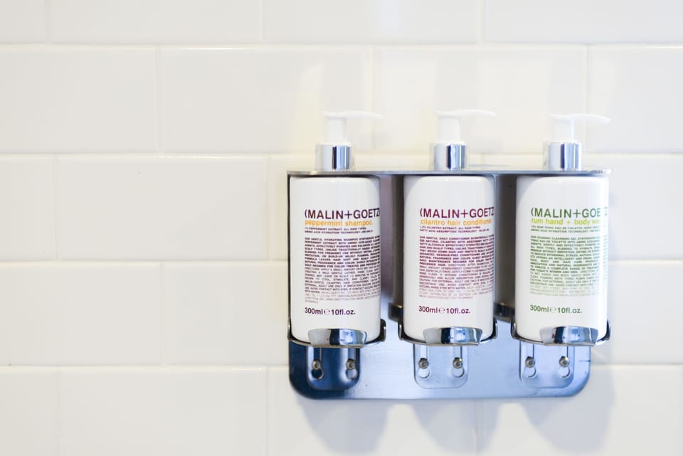 Shower, designer toiletries, hair dryer, bathrobes