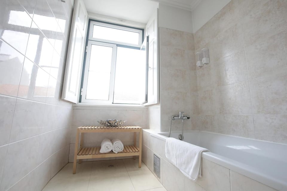 Bathtub, slippers, towels