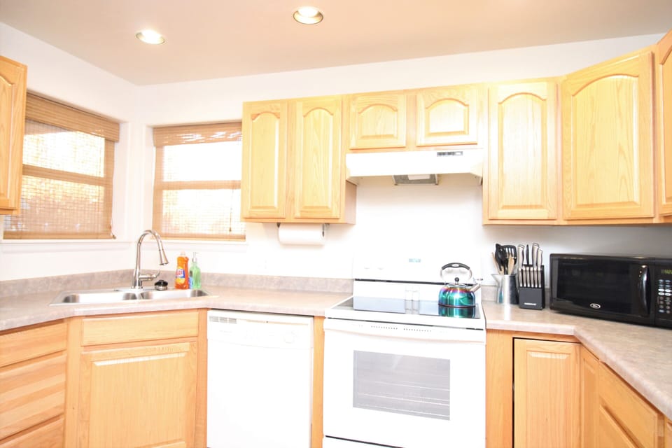 Kitchen has a toaster, blender, crock-pot, microwave and a drip coffee maker