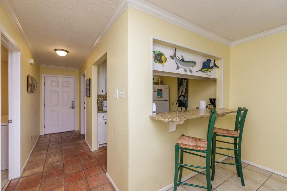 Enjoy coastal charm with your breakfast bar overlooking the kitchen, perfect for morning coffee or casual meals.