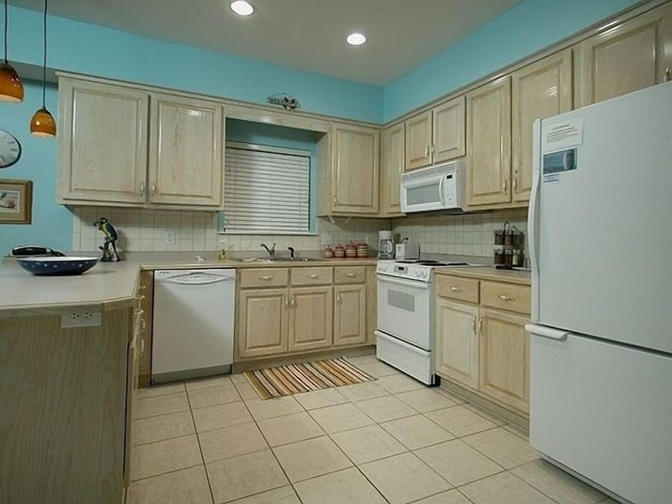 Our spacious kitchen is stocked with everything a chef might desire.