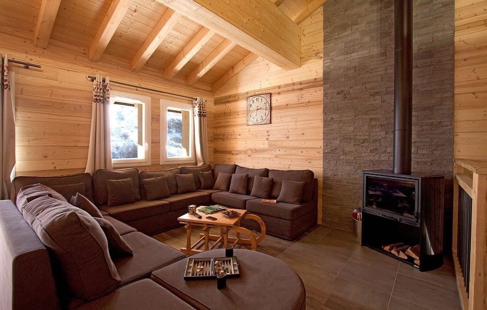 Take a seat in front of the fireplace and enjoy the living area.