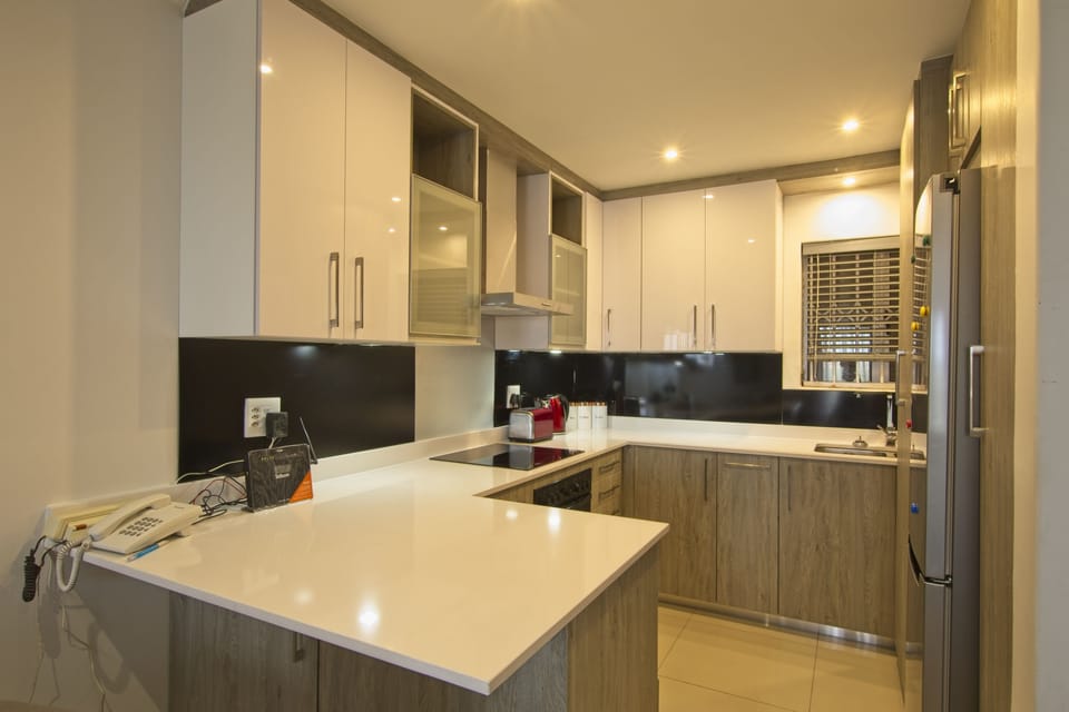 Luxury Apartment, Garden View (Beachfront) | Private kitchen | Full-size fridge, microwave, oven, stovetop