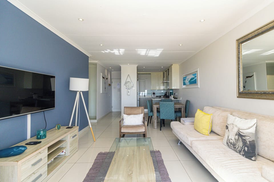 Luxury Apartment, 2 Bedrooms, Ocean View, Beachfront | Living area | Flat-screen TV, DVD player