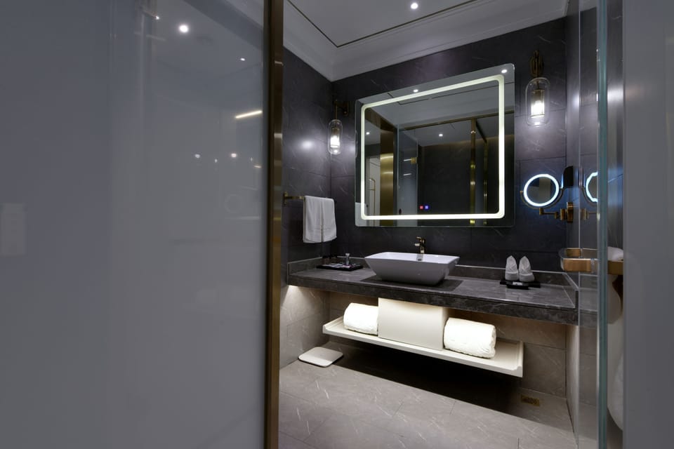 Shower, rainfall showerhead, designer toiletries, hair dryer