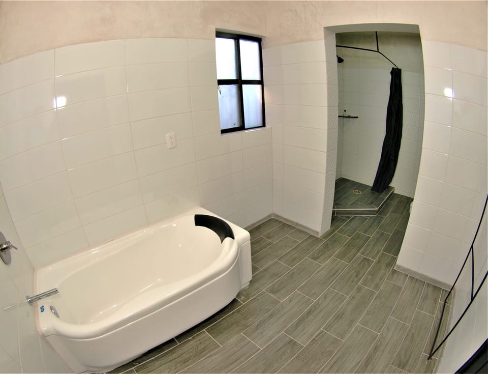 Shower, rainfall showerhead, hair dryer, towels