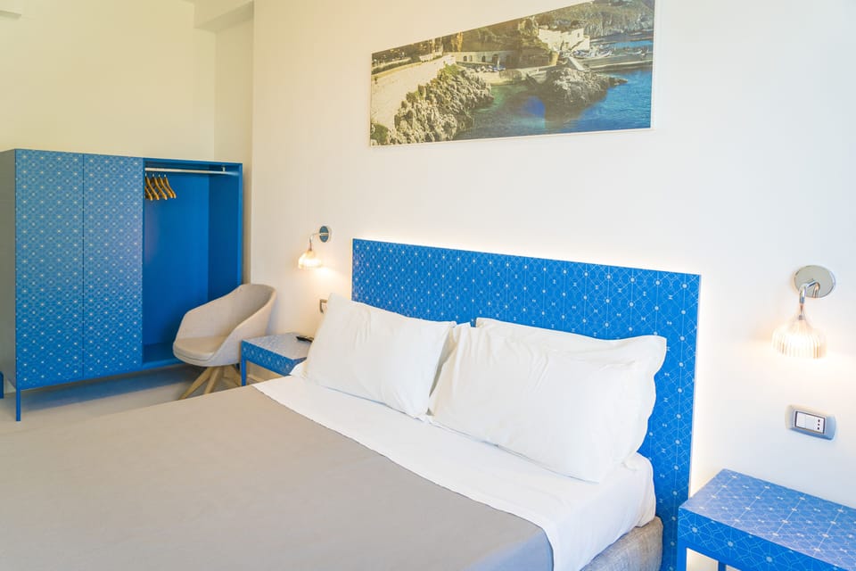 Comfort Double Room, Partial Sea View | Minibar, in-room safe, individually decorated, desk