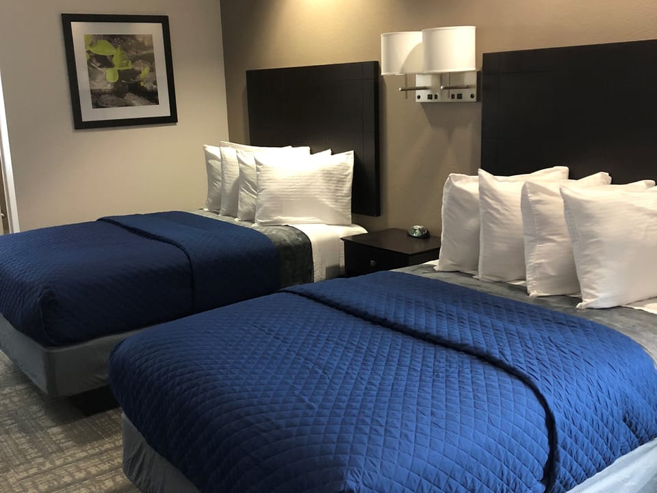 Suite with two beds | Desk, blackout drapes, iron/ironing board (on request), WiFi (free)