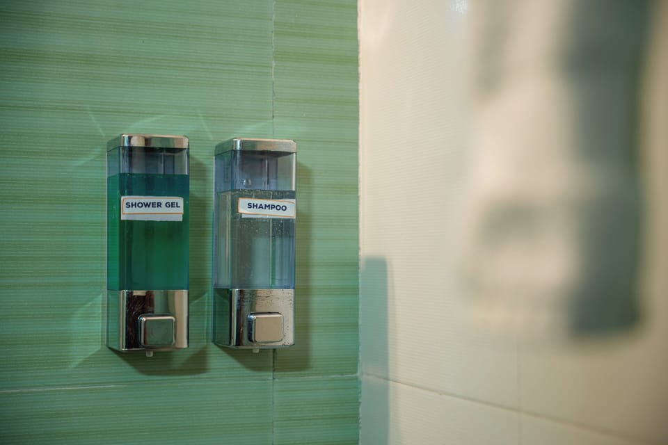 Shower, designer toiletries, hair dryer, bathrobes