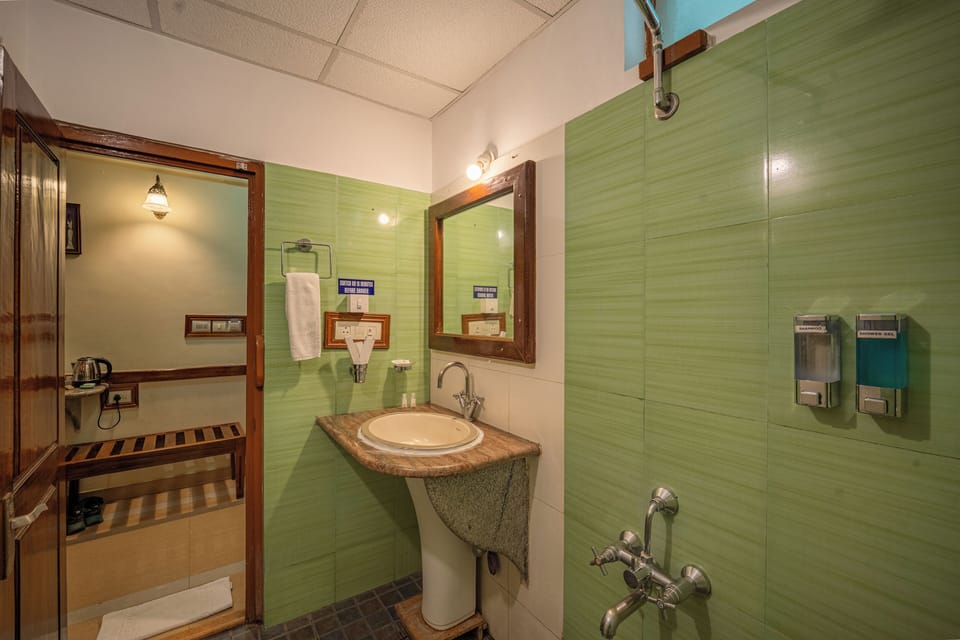 Shower, designer toiletries, hair dryer, bathrobes