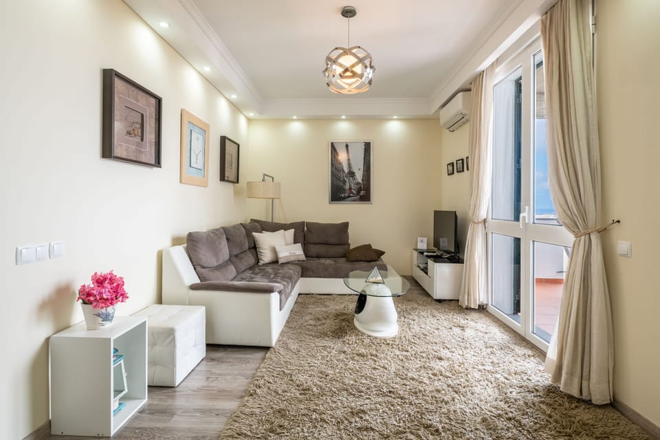 Apartment, 1 Bedroom, Balcony, Sea View | Living area | Flat-screen TV