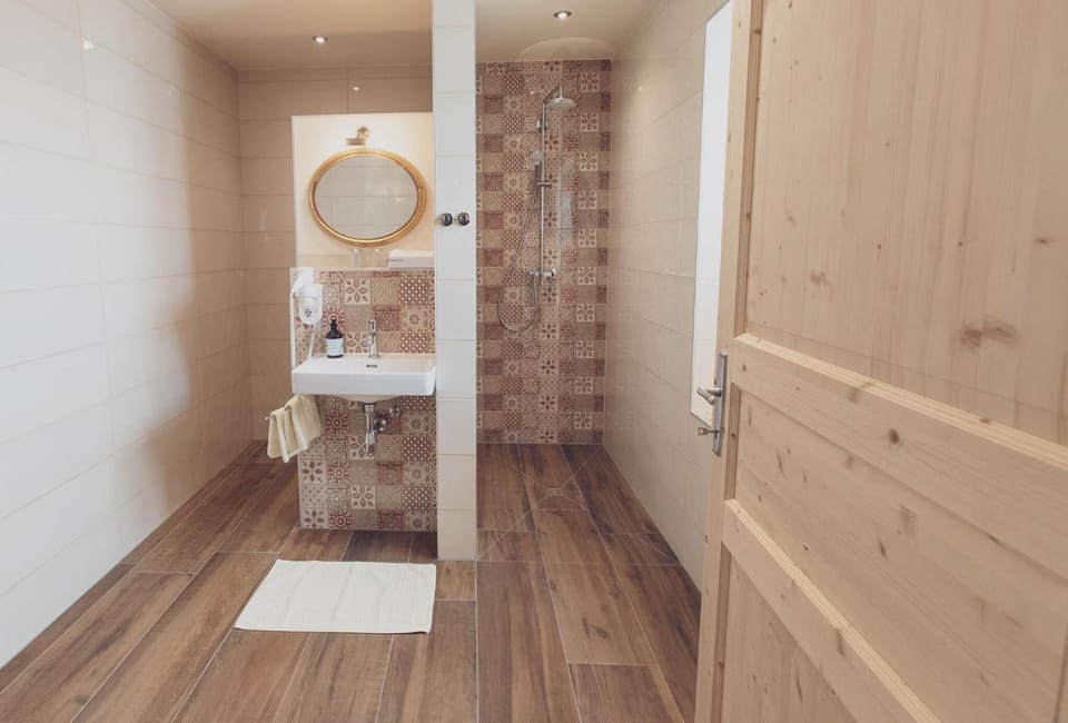 Shower, rainfall showerhead, hair dryer, towels