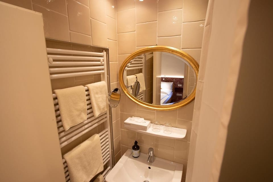 Shower, rainfall showerhead, hair dryer, towels
