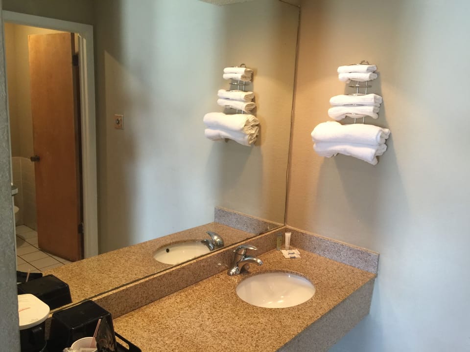 Combined shower/tub, soap, shampoo, toilet paper