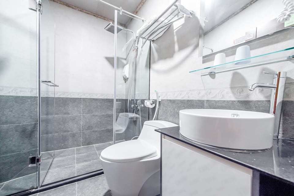 Double Room, Lake View | Bathroom | Shower, hair dryer, slippers, towels