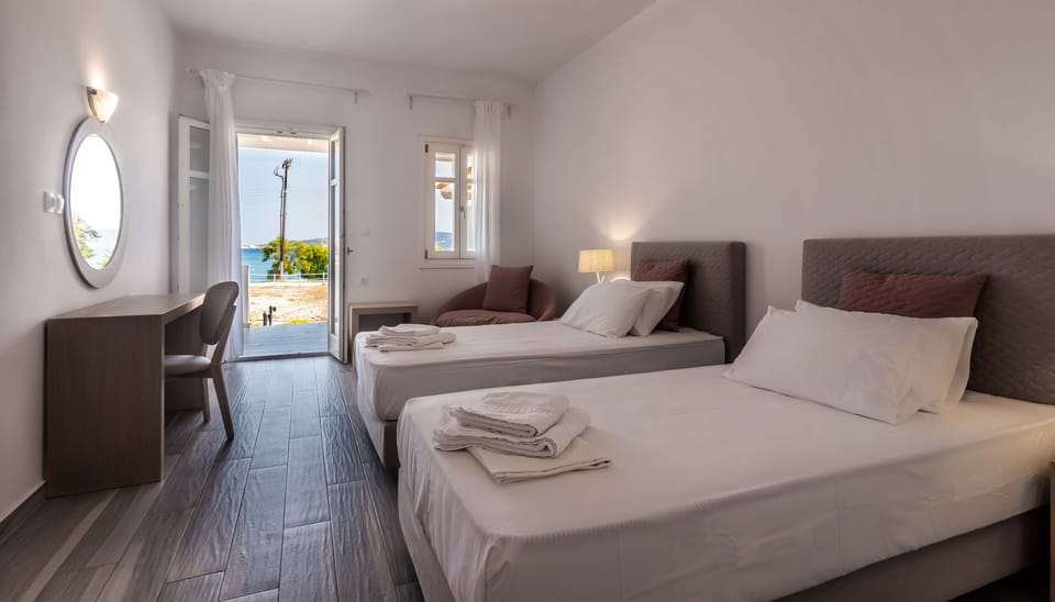 Deluxe Room, Sea View, Ground Floor | Hypo-allergenic bedding, pillowtop beds, in-room safe, desk