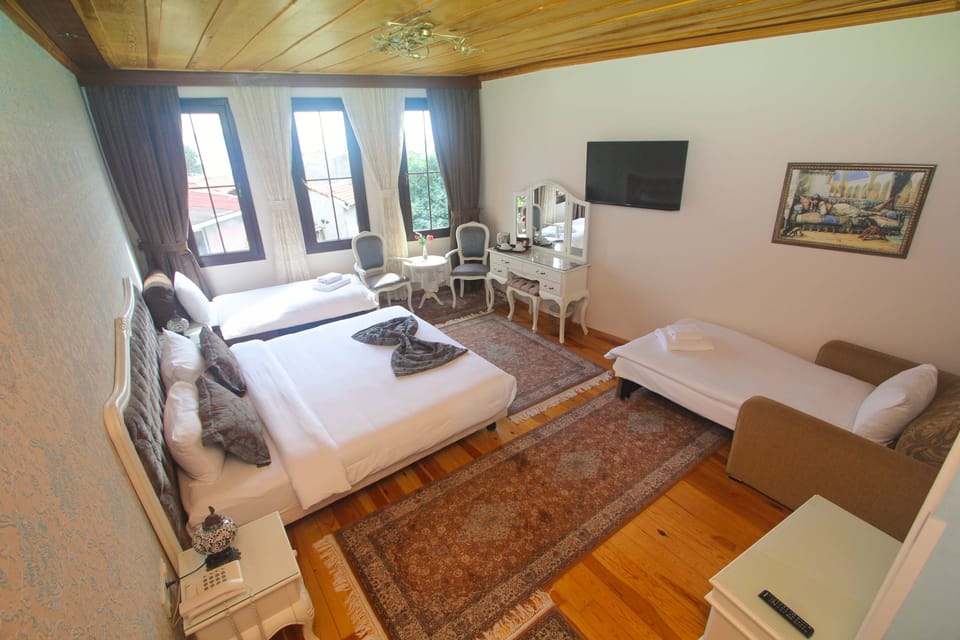 Family Room | Premium bedding, down comforters, minibar, in-room safe