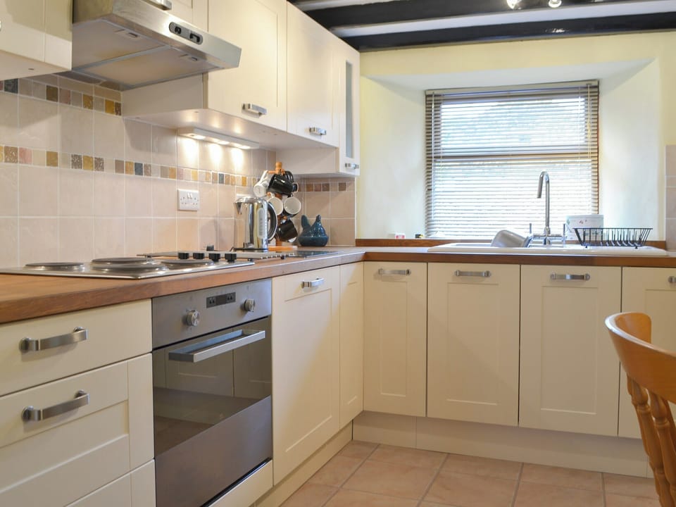 Well appointed kitchen with modest dining area | Annie&rsquo;s Cottage, Millom