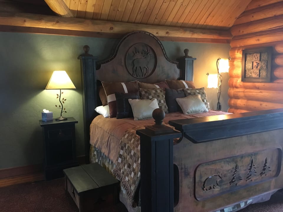 The master suite features one-of-a-kind furnishings and elegant bedding.