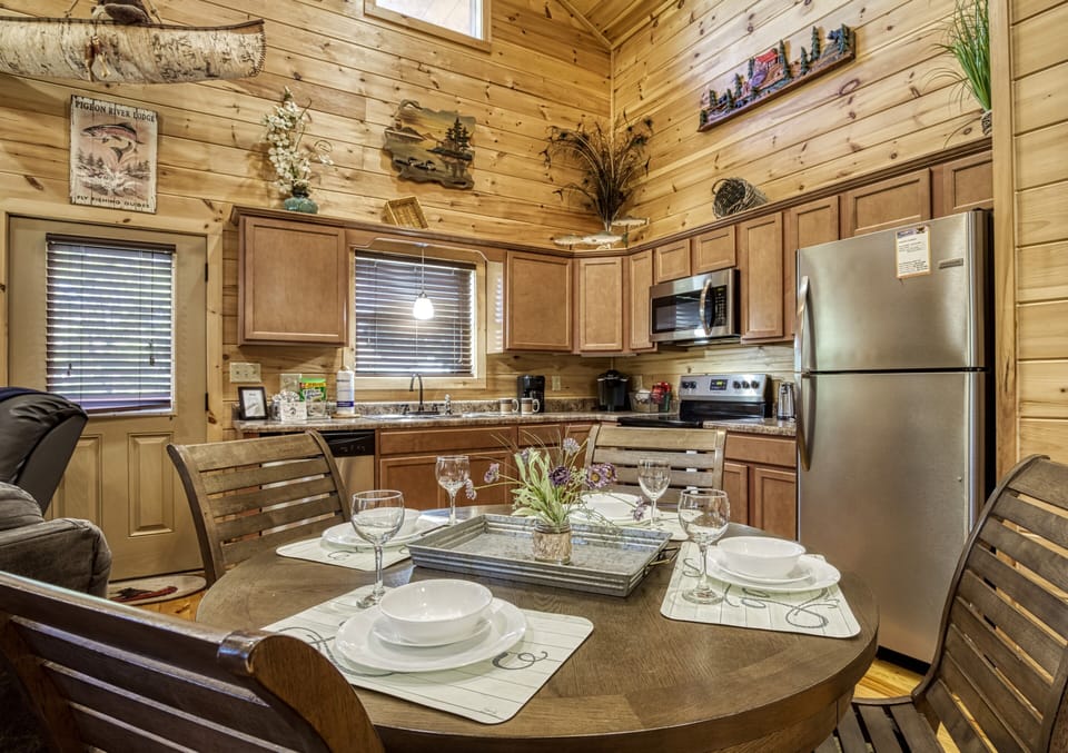 Cabin on the River in Pigeon Forge "River Haven" - Dining table and fully furnished kitchen